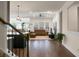Open living room with hardwood floors and a view to the kitchen at 386 Tupelo Lake Dr, Summerville, SC 29486
