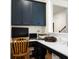 Built-in home office with dark blue cabinets and a white countertop at 386 Tupelo Lake Dr, Summerville, SC 29486