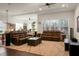 Spacious living room with leather sofas, hardwood floors and a ceiling fan at 386 Tupelo Lake Dr, Summerville, SC 29486