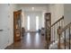 Entry hall with hardwood floors, display cabinets, and staircase at 386 Tupelo Lake Dr, Summerville, SC 29486