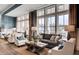 Relaxing lounge area featuring plush seating and large windows at 386 Tupelo Lake Dr, Summerville, SC 29486