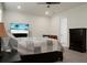 Bright bedroom with a large bed, dresser, and an ensuite bathroom at 386 Tupelo Lake Dr, Summerville, SC 29486