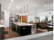 Open concept kitchen and living area with island, stainless steel appliances and hardwood floors at 386 Tupelo Lake Dr, Summerville, SC 29486