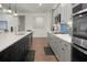 Modern kitchen with gray and dark cabinets, stainless steel appliances and quartz countertops at 386 Tupelo Lake Dr, Summerville, SC 29486