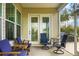 Enjoyable screened porch with comfortable seating and French doors at 386 Tupelo Lake Dr, Summerville, SC 29486