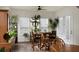Relaxing sunroom filled with plants, a small table and chairs, and hardwood floors at 386 Tupelo Lake Dr, Summerville, SC 29486