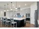 Open concept kitchen with gray cabinets, stainless steel appliances, and an island with seating at 386 Tupelo Lake Dr, Summerville, SC 29486