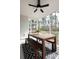 Relaxing screened porch with wooden dining set and wooded views at 366 Wappoo Trace Ln, Summerville, SC 29486