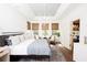 Spacious bedroom with king-size bed, hardwood floors, and ample natural light at 366 Wappoo Trace Ln, Summerville, SC 29486