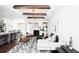 Open living room with hardwood floors, exposed wooden beams, and comfortable seating at 366 Wappoo Trace Ln, Summerville, SC 29486