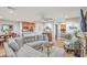 Open living room with gray sectional sofa, wood floors, and a fireplace at 266 Alexandra Dr # 15, Mount Pleasant, SC 29464