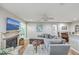Living room with sectional sofa, fireplace, and large TV at 266 Alexandra Dr # 15, Mount Pleasant, SC 29464