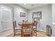 Charming dining area with a round wooden table and four chairs at 266 Alexandra Dr # 15, Mount Pleasant, SC 29464