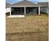 Home's backyard with screened porch and new sod at 741 Blue Iris Way, Summerville, SC 29486