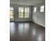 Spacious living area with hardwood floors and large windows at 741 Blue Iris Way, Summerville, SC 29486