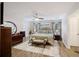 Spacious bedroom with wood floors, large bed, and ample natural light at 5 Avon Ct, Charleston, SC 29407