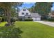 Two-story home with double garage and manicured lawn at 5 Avon Ct, Charleston, SC 29407