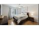 Bedroom with a queen bed, wood floors, and lots of natural light at 5 Avon Ct, Charleston, SC 29407