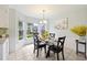 Bright breakfast nook with glass table and bay window at 5 Avon Ct, Charleston, SC 29407
