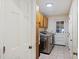 Laundry room with washer, dryer, and built-in cabinets at 5 Avon Ct, Charleston, SC 29407