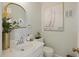 Updated half bathroom with white vanity and decorative accents at 5 Avon Ct, Charleston, SC 29407