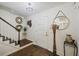 Inviting entryway with staircase, wood floors, and decorative accents at 5 Avon Ct, Charleston, SC 29407