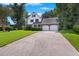 Two-story home with double garage and manicured lawn at 5 Avon Ct, Charleston, SC 29407
