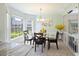 Kitchen breakfast nook with glass table and built-in window seat at 5 Avon Ct, Charleston, SC 29407