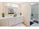 Bathroom with double vanity, walk-in shower, and modern fixtures at 5 Avon Ct, Charleston, SC 29407