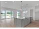 Modern kitchen island with quartz countertops and gray cabinets at 455 Evening Glow Ln, Summerville, SC 29486