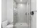 Modern bathroom with a walk-in shower, gray tile, and glass enclosure at 301 Longshore St # 441, Charleston, SC 29492