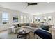 Spacious living room with hardwood floors, a sectional sofa, and lake views at 301 Longshore St # 441, Charleston, SC 29492