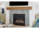 Modern gas fireplace with a rustic wooden mantel at 301 Longshore St # 441, Charleston, SC 29492