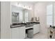 Elegant bathroom with double vanity, dark countertop and large shower at 301 Longshore St # 441, Charleston, SC 29492