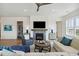 Spacious living room features a fireplace, built-in shelving, and hardwood floors at 301 Longshore St # 441, Charleston, SC 29492