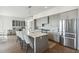 Modern kitchen with gray cabinets, quartz countertops, and stainless steel appliances at 301 Longshore St # 441, Charleston, SC 29492
