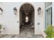 Building entrance with arched walkways, seating, and lanterns at 301 Longshore St # 441, Charleston, SC 29492