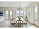 Bright dining room with a large table and chandelier, offering water views at 301 Longshore St # 441, Charleston, SC 29492