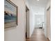 Bright hallway with hardwood floors, leading to bedroom and closet at 301 Longshore St # 441, Charleston, SC 29492