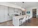 Modern kitchen with island, gray cabinets, and a large pantry at 301 Longshore St # 441, Charleston, SC 29492
