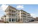 Exterior view of a multi-story building with balconies and retail spaces at 301 Longshore St # 441, Charleston, SC 29492