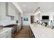 Modern kitchen with gray cabinets, quartz countertops, and stainless steel appliances at 301 Longshore St # 441, Charleston, SC 29492