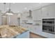 Modern kitchen with white cabinets and double oven at 361 Wappoo Trace Ln, Summerville, SC 29486