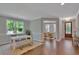 Light-filled dining area with a white table and bench at 361 Wappoo Trace Ln, Summerville, SC 29486