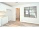 Kitchen with white cabinets and laundry access at 1910 Tropicana Rd # 9-B, North Charleston, SC 29406