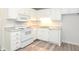 White kitchen with updated appliances and laminate flooring at 1910 Tropicana Rd # 9-B, North Charleston, SC 29406