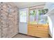 Back porch with brick wall and door leading outside at 1910 Tropicana Rd # 9-B, North Charleston, SC 29406