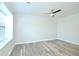 Bright bedroom with neutral walls, wood-look flooring, and ceiling fan at 1910 Tropicana Rd # 9-B, North Charleston, SC 29406