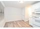 Bright dining area with hardwood floors and white cabinetry at 1910 Tropicana Rd # 9-B, North Charleston, SC 29406