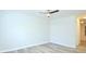 Bright bedroom with neutral walls, wood-look flooring, and ceiling fan at 1910 Tropicana Rd # 9-B, North Charleston, SC 29406